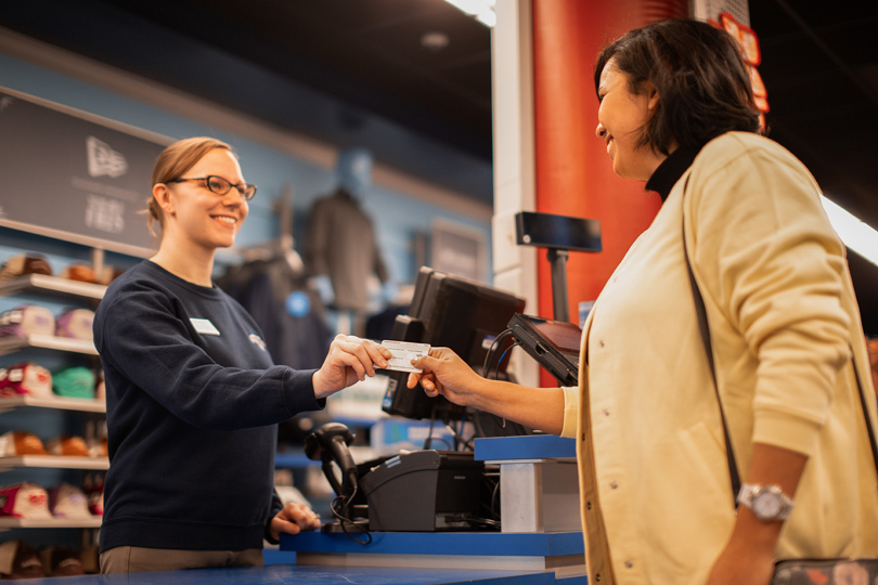 A guest purchasing souvenirs at Niagara Falls State Park