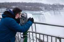 A Niagara Falls visitor using a view finder at the top of the falls