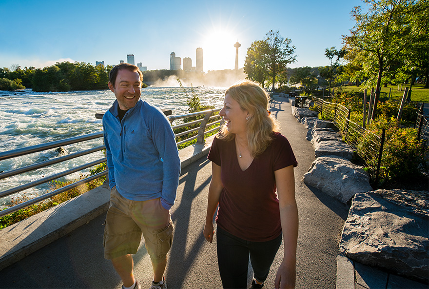 couple walking together along the water